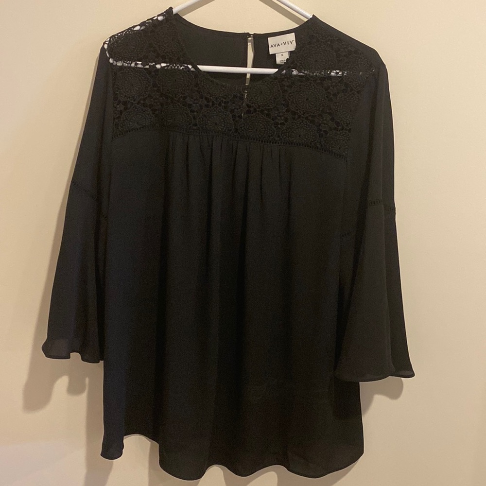 Adorable black dress top with wider sleeves. Like new condition.